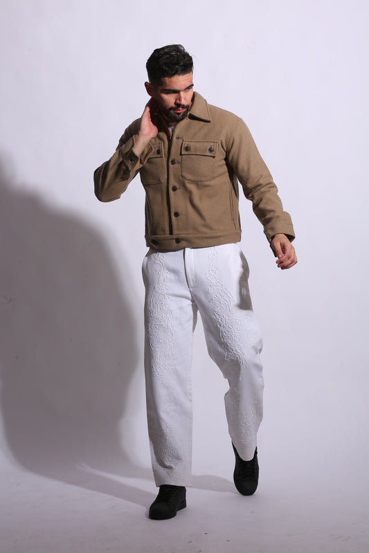 Person wearing a beige trench coat on a white background