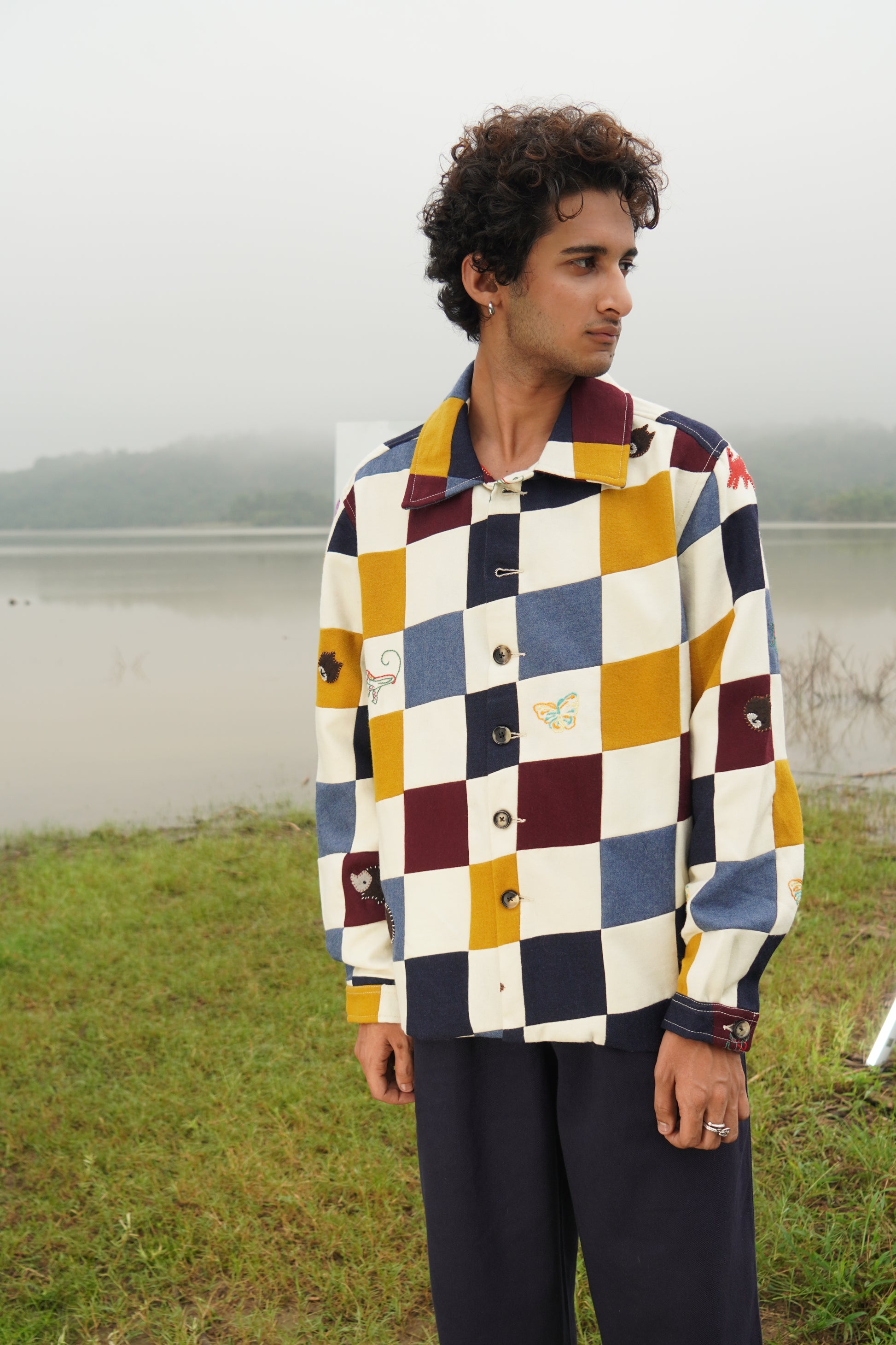 Jackson gender-fluid multicolor patchwork wool shacket with appliqué embroidery 
“Chic unisex patchwork embroidered wool jacket in multicolor panels” 