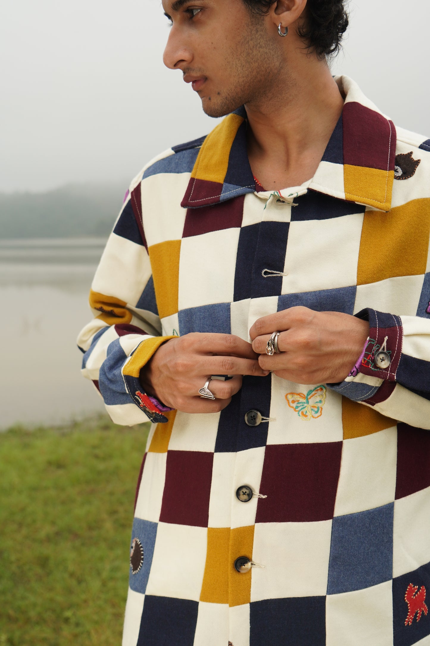 Jackson gender-fluid multicolor patchwork wool shacket with appliqué embroidery 
“Chic unisex patchwork embroidered wool jacket in multicolor panels” 