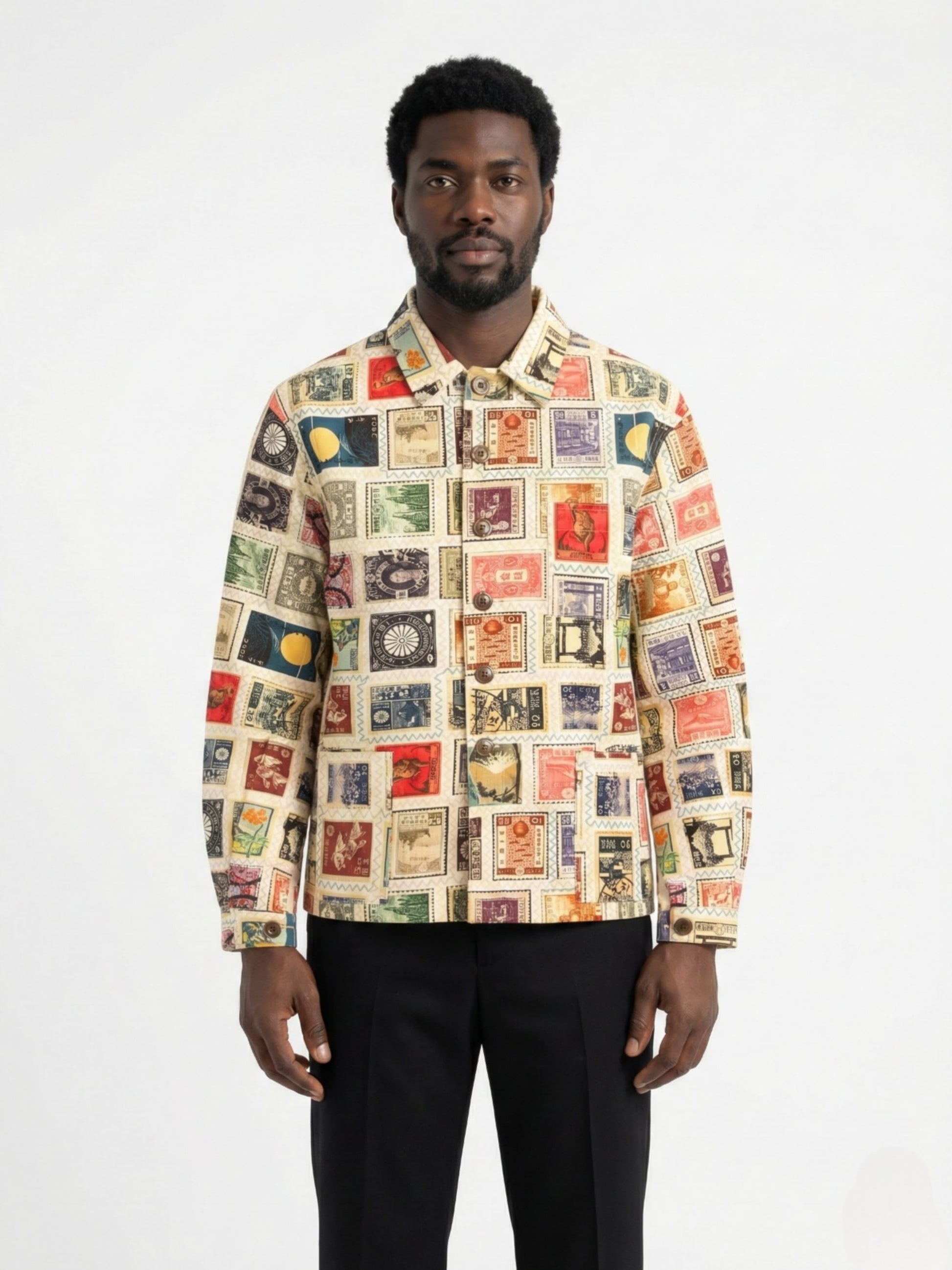 Man wearing a colorful patterned shirt on a white background