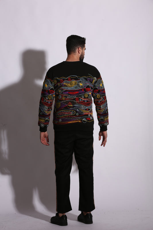 Hand sowed colourful stitches on black Nova Thread Sweatshirt. 